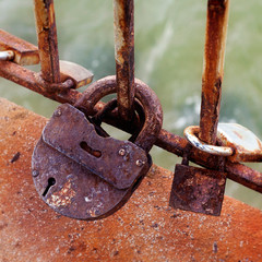Rusty lock on the background of the sea