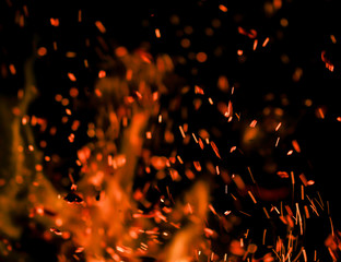 flame of fire with sparks on a black background