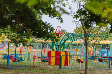 Fototapeta na wymiar Lonely park with a swing bored for children