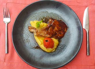 Pork steak with tomato and potato