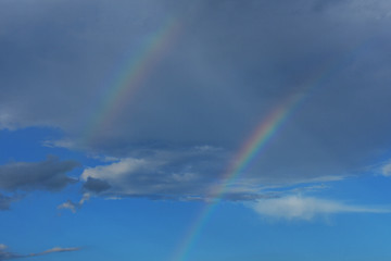 Fototapeta na wymiar Beautiful double rainbow over the sky 