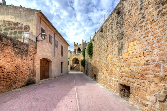 Walls and narrow streets of Alcudia old town, Mallorca, Spain