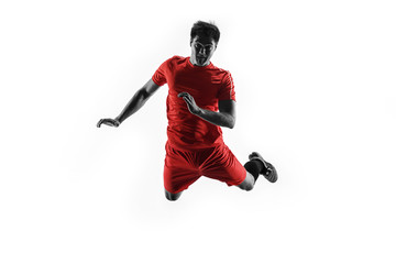 Professional football soccer player in motion isolated on white studio background