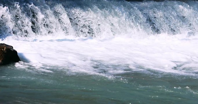 Close up on a river waterfall