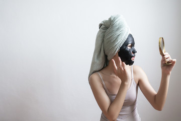 Beautiful woman with Black  facial mask, Lifestyle concept