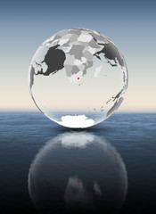 Lesotho on translucent globe above water