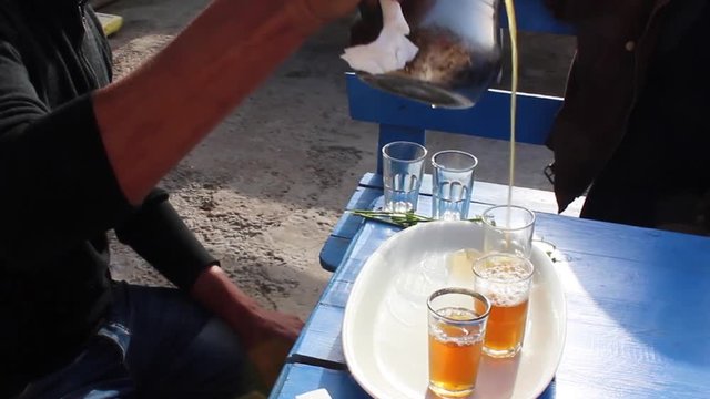 Man Serving Tea in Imsouane, Morocco