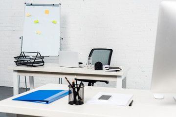 interior of modern white office with computers on desks