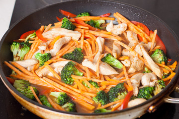 Chicken stir fry with sweet potato noodles preparation