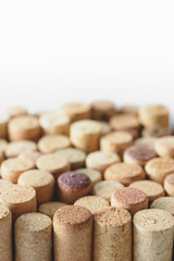Fototapeta na wymiar Pile of assorted used wine corks isolated on white background. Close up view.
