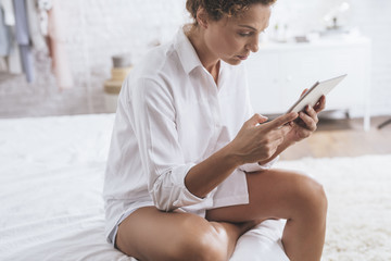 Woman Using Tablet at Home