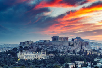 The Acropolis in Athens, Greece at sunrise. Scenic travel background with dramatic sky.