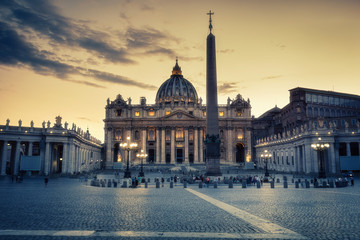 St. Peter's Basilica in Rome, Italy, at sunset. Stylised travel and architectural background.