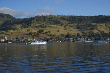 A scenic view with boat and Komodo village at Indonesia