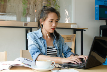 Happy asian woman working in coffee shop.business concept.