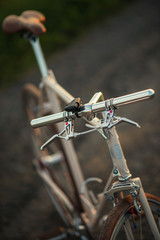 Retro bicycle on the road in sunset, detail photography of bike components