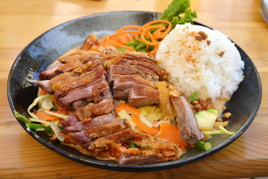 Roasted duck with vegetables and rice, asian style