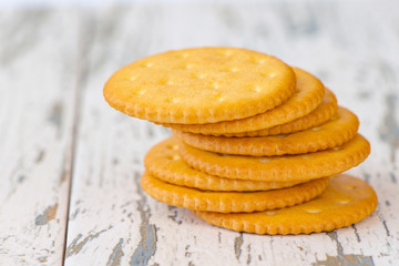 A few dry cracker cookies on a old wooden board