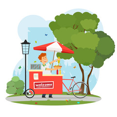 Obraz premium seller of hot dogs with a mobile cart in the city park.