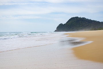 Sea view from tropical beach. Summer paradise beach of island with clouds on horizon. Ocean beach relax, outdoor travel.