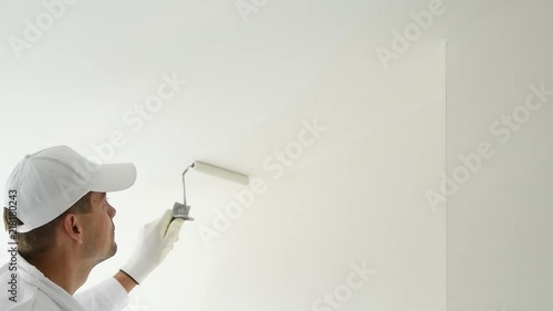Painting Painter With Paint Roller Covering Ceiling With