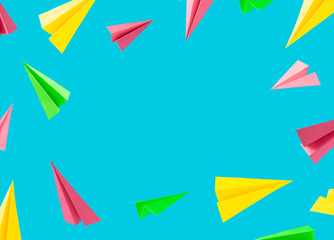 Colorful background pattern made with paper airplanes on sky blue background. Minimal back to school concept.
