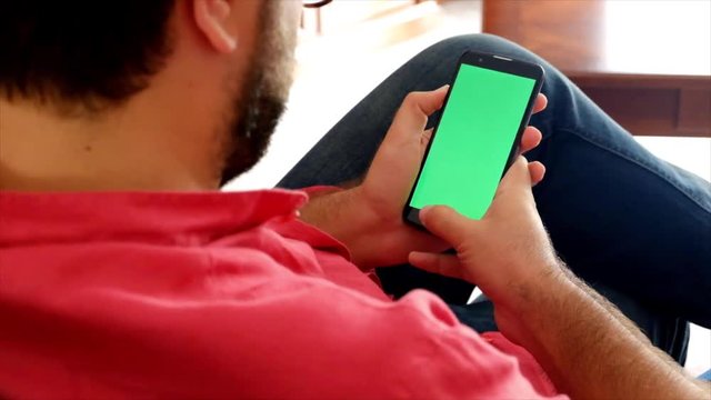 a man view his smartphone screen