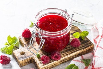 Strawberry jam in glass jar.