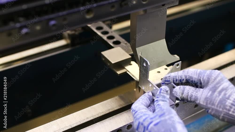 Poster man working with sheet metal and special machine tools for bending. scene. modern machines can accur