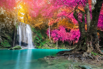 Fototapeta na wymiar Amazing beauty of nature, waterfall at colorful autumn forest 