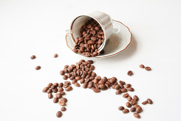Coffee beans in the unturned white porcelain cup 