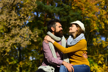 Girl and bearded guy or happy lovers on date hug