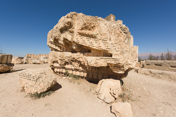 Carved fragment of architrave in ancient roman temple of Jupiter, Baalbec heritage site, Lebanon.