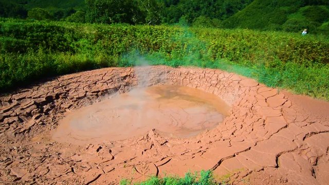 Mud pots in Valley of Geysers. Tourist season in Kamchatka Peninsula. Kronotsky Nature Reserve. The summer stock footage video