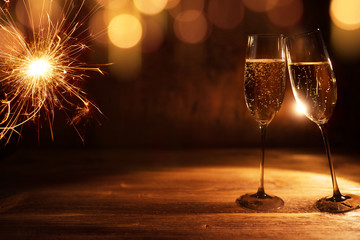 Golden new year background with champagne