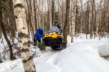 Picture with a snowmobile.