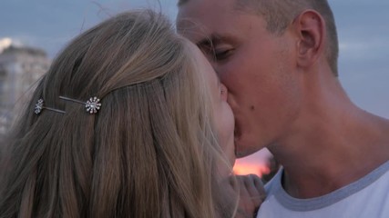 Young People Lovers on the romantic Date kissing hugging in Park - Night