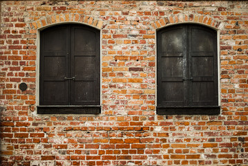 old wood window on a brick wall