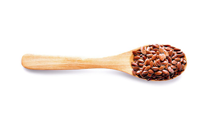 Flax seeds in wood on white background