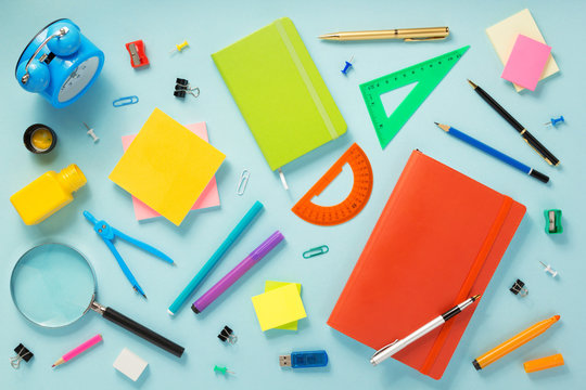 notebook and school accessories at abstract background