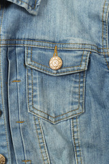 Clothes, shoes and accessories - top view fragment blue jeans jacket