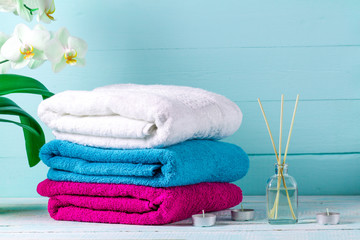 Towels on a blue background. Hygiene. Shower. Aroma therapy