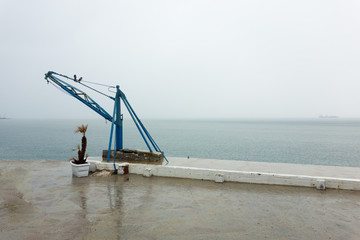 Fototapeta premium Two birds on a seaside crane, Thessaloniki, Greece
