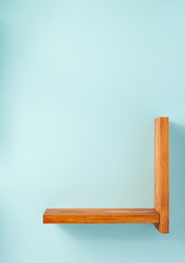 woden shelf at abstract wall background