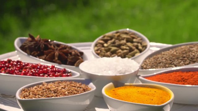 Dry spices on a rotary table. 4K. Macroshooting.