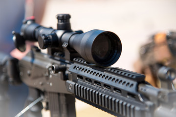 Naklejka premium Optical sight on weapons close-up (danger, goal, terrorism - concept)