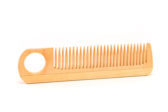 Wooden comb isolated on white background