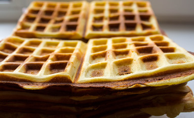 a Belgian waffles on a plate on a table