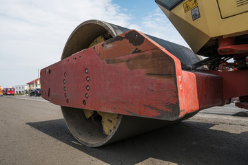 Details of yellow red Heavy Vibration roller compactor at asphalt pavement works for road...