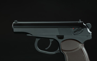 Automatic gun pistol on dark background